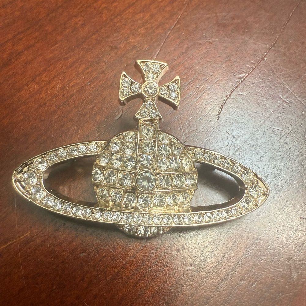 Brand new vivienne westwood gold Crystal Brooch Aprox 1.5”h 2.5”w
